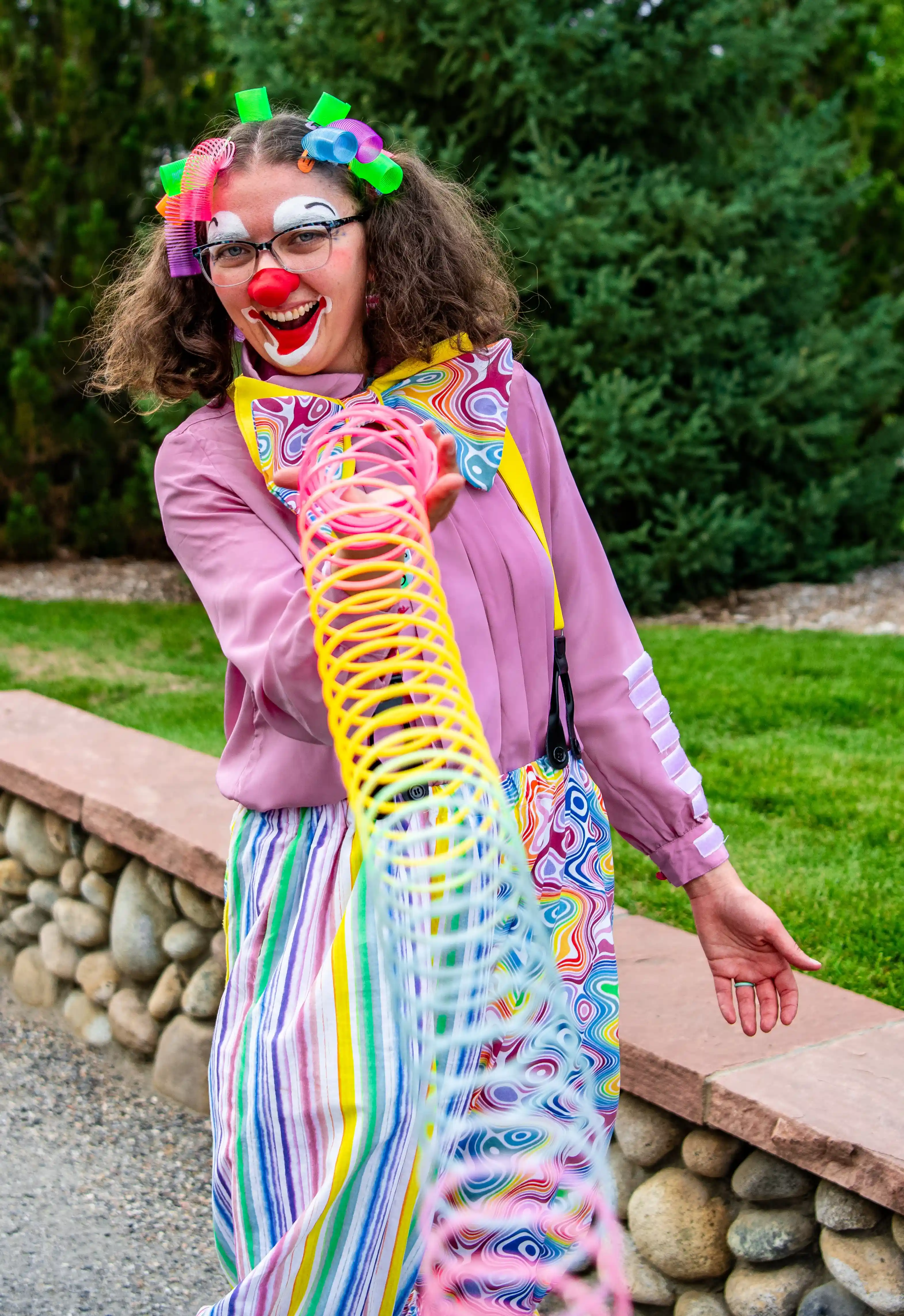 Boing the Clown playing with a spring toy